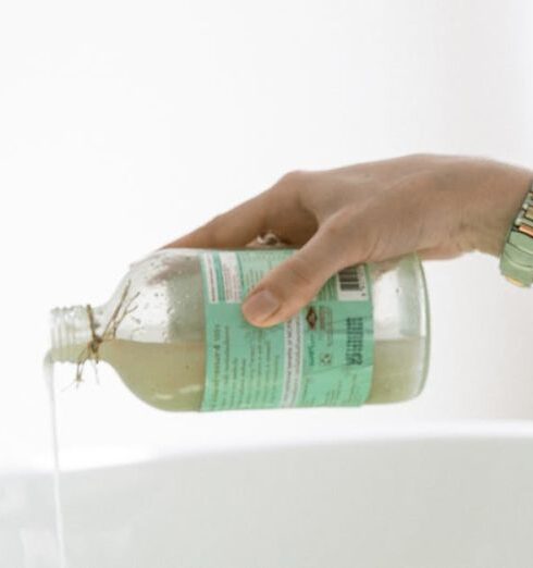 Skincare - Person Pouring Aromatic Soap On Water