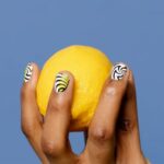 Benefits - Close-Up Shot of a Person Holding a Lemon