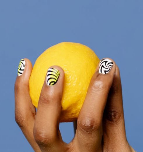 Benefits - Close-Up Shot of a Person Holding a Lemon