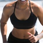 Weight Loss - Woman Wearing Black Sports Bra and Jogger Shorts Smiling