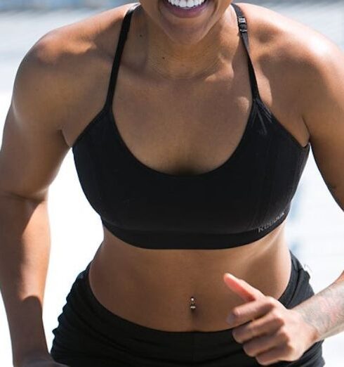 Weight Loss - Woman Wearing Black Sports Bra and Jogger Shorts Smiling