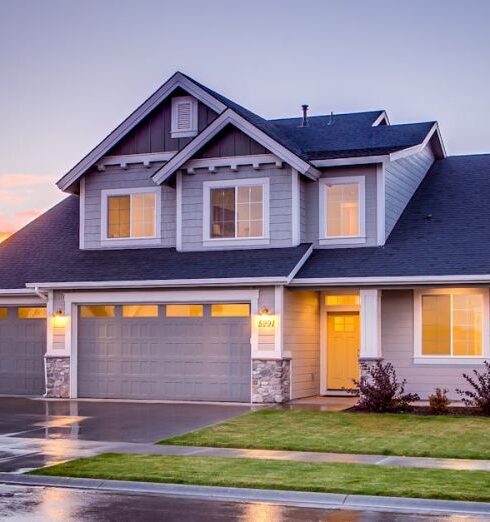 Home - Blue and Gray Concrete House With Attic during Twilight