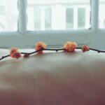 Wellness - Orange Petaled Flowers on Person's Back