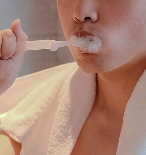 Habits - Close-up Photo of Man brushing his Teeth