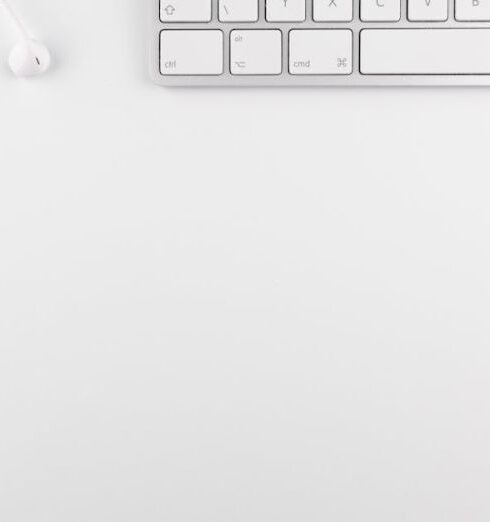 Minimalism - Top View Photo of Keyboard Near Earphones