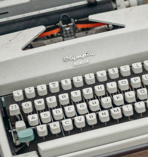 Fleas - Green and Gray Typewriter on Red Table