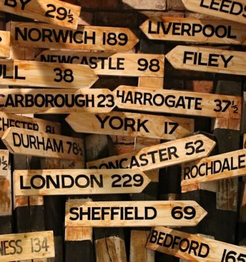 Signs - Brown Wooden Signage Hanging Beside Wall