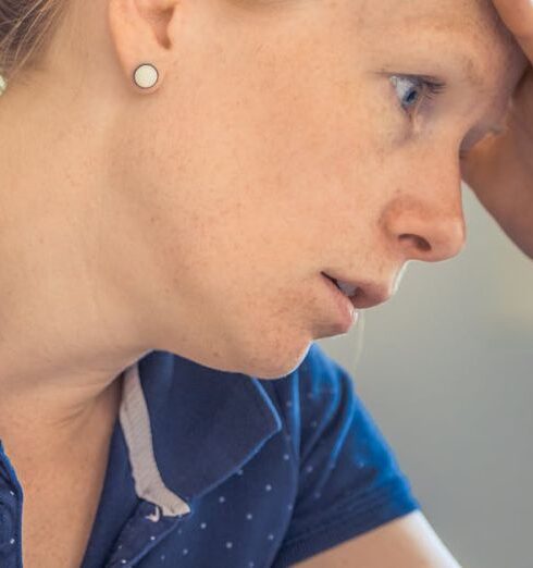 Anxiety - Woman Sitting in Front of the Laptop Computer in Shallow Photo