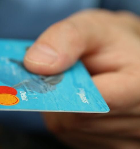 Debt - Person Holding Debit Card