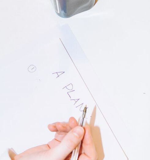 Plan - Person Writing on White Paper