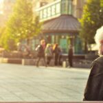 Retirement - Man Sitting on Wooden Bench Wearing Black Leather Jacket