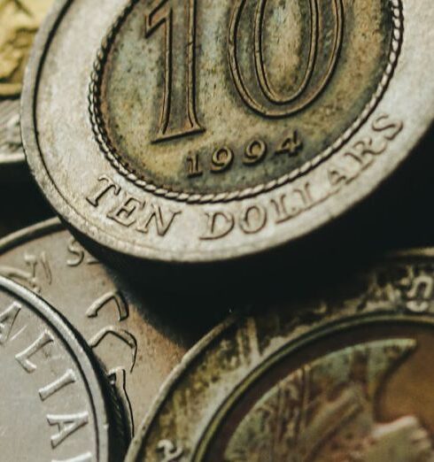 Fund - Closeup of old golden and silver coins placed in heap next to each other