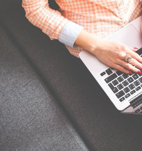 Plan - Person Sitting on Gray Sofa While Using Macbook