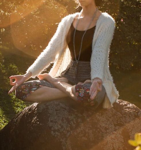 Wellness - Woman Meditating on Rock