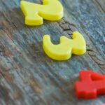 Tuition - Multicolored numbers for counting on wooden table