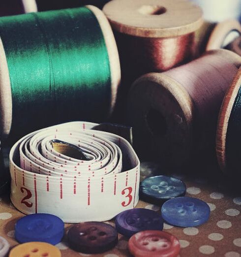 Embroidery - Assorted-color Button Pin on Brown Surface