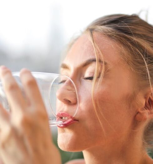 Drink Water - Woman Drinking from Glass