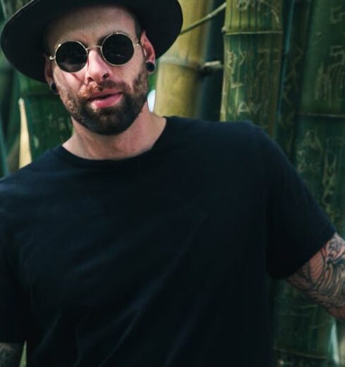 T-Shirts - Man Holding Bamboo Plant Wearing Sunglasses and Fedora Hat