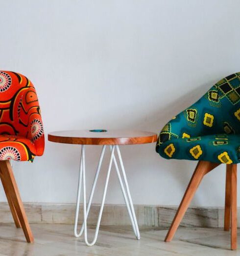 Furniture - Two Assorted-color Padded Chairs Near Side Table