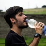 Drink Water - Man Wearing Black Shirt Drinking Water