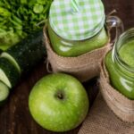 Detox - Green Apple Beside of Two Clear Glass Jars