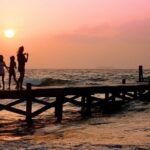 Family - People Standing on Dock during Sunrise