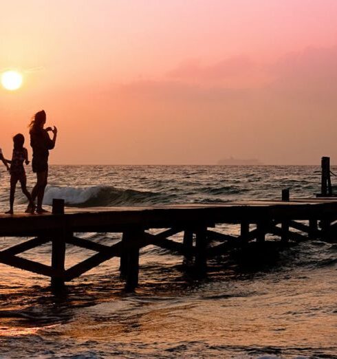 Family - People Standing on Dock during Sunrise