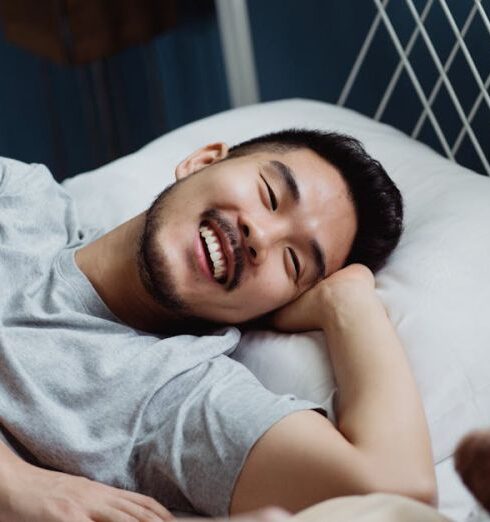 Bed - Two Men in Bed Looking at Each Other