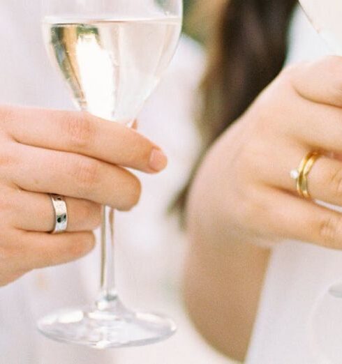 Interactions - Photograph of Wine Glasses in Mans and Womans Hands