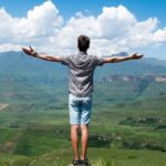 Life - Man Wearing Grey Shirt Standing on Elevated Surface