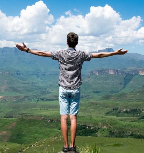 Life - Man Wearing Grey Shirt Standing on Elevated Surface