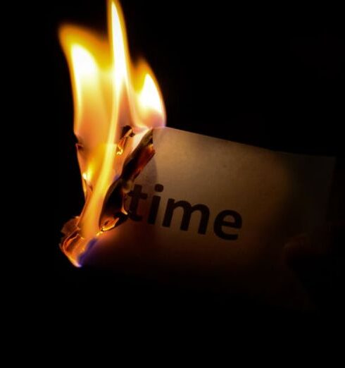 Time - Person Holding Burning Paper in Dark Room