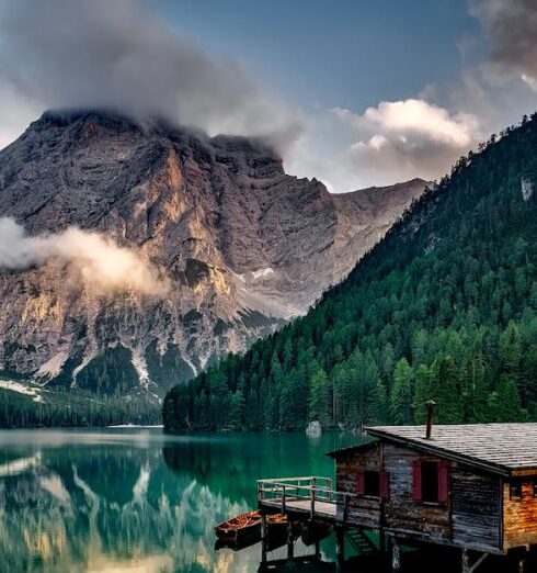 Nature - Mirror Lake Reflecting Wooden House in Middle of Lake Overlooking Mountain Ranges