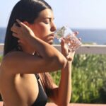 Drink Water - Photography of a Woman Wearing Black Bikini Drinking Water