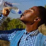 Drink Water - Photography of A Man Drinking Water