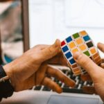 Distractions - 4x4 Rubik's Cube on a Man's Hand