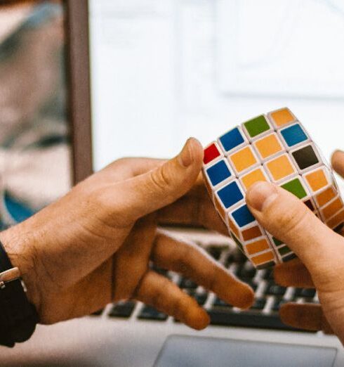 Distractions - 4x4 Rubik's Cube on a Man's Hand