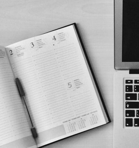 Planner - Flat Lay Photography of Unfold Book Beside Macbook