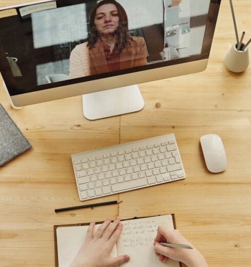 Task - Person Writing on Notebook