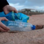 Volunteering - Person Holding Clear Plastic Bottle