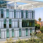 Opportunities - A building with a large glass roof and a courtyard