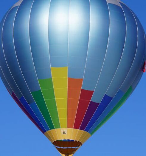 Experience - Hot Air Balloon Flying Against Blue Sky