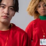 Volunteering - Man and Woman in Red Crew Neck Shirt