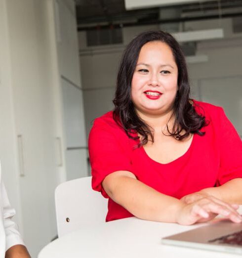 Mentoring - Woman Wearing Red Top Holding Silver Macbook