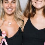 Volunteering - 2 Women in Black Tank Top Holding Pink Ribbon