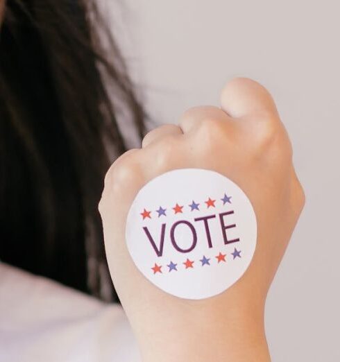 Opportunities - Smiling Woman with Vote Sticker on her Fist