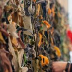 Volunteering - Women Tying Scrap Textile to a et