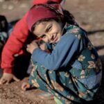 Refugees - Children Playing Outside in the Mud