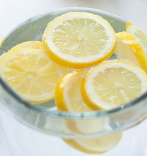 Drink Water - Clear Glass Pitcher Filled With Clear Liquid and Slices of Lemon