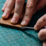 Tools - Person Holding Brown Leather Material